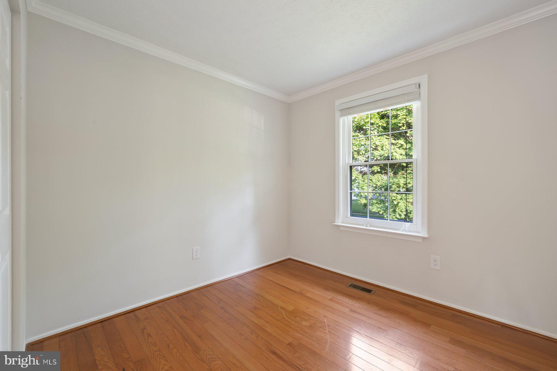 8304 Grainfield Road Severn, MD 21144 - Photo 14 of 49 an empty room with a window