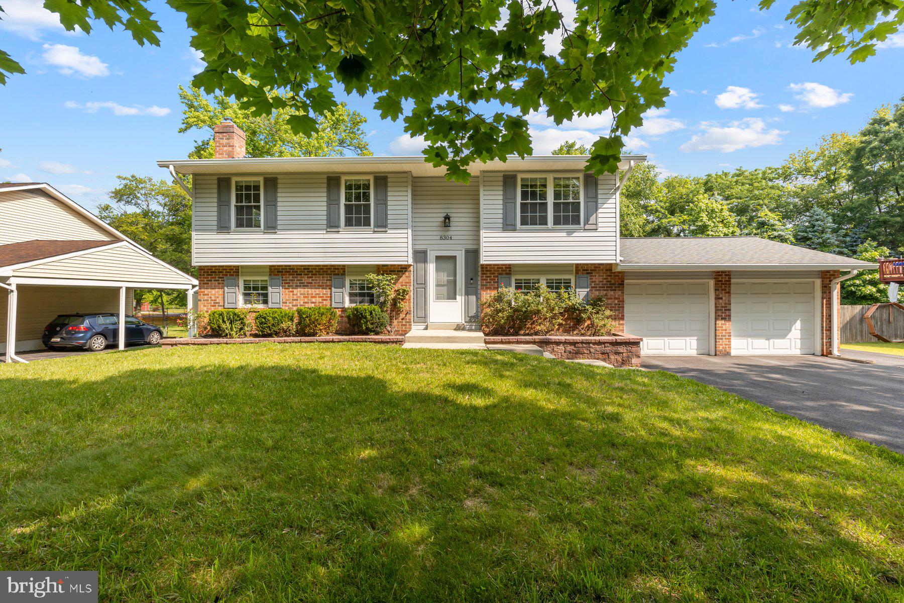 8304 Grainfield Road Severn, MD 21144 - Photo 2 of 49 a front view of house with yard and green space