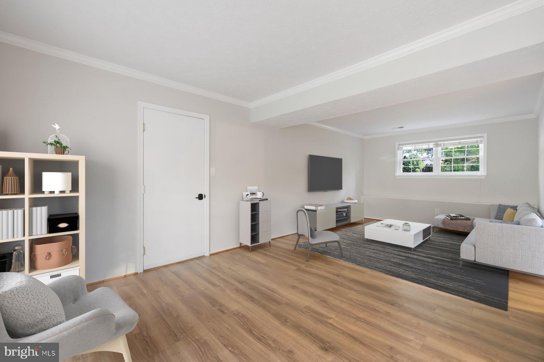 8304 Grainfield Road Severn, MD 21144 - Photo 21 of 49 a bedroom with a bed and wooden floor