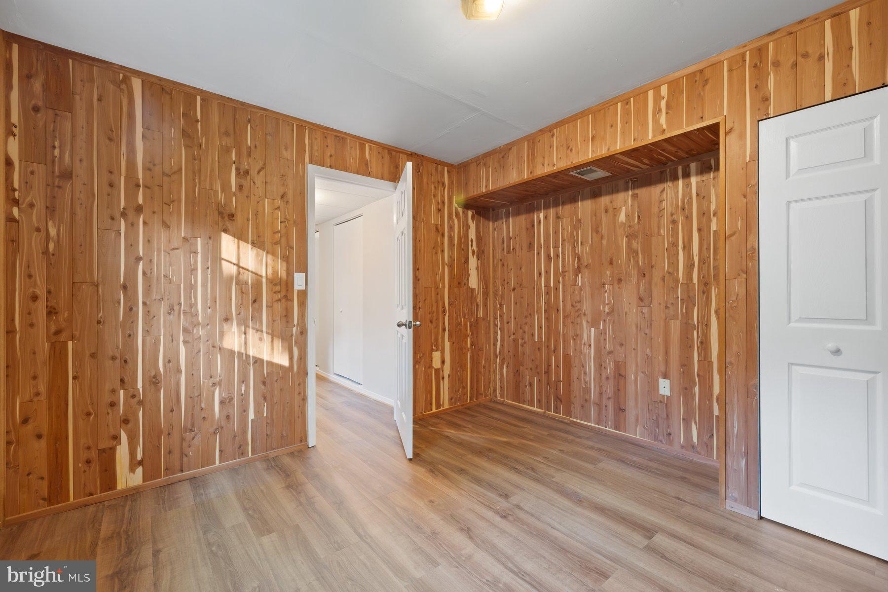8304 Grainfield Road Severn, MD 21144 - Photo 26 of 49 a view of a room with wooden floor and entryway