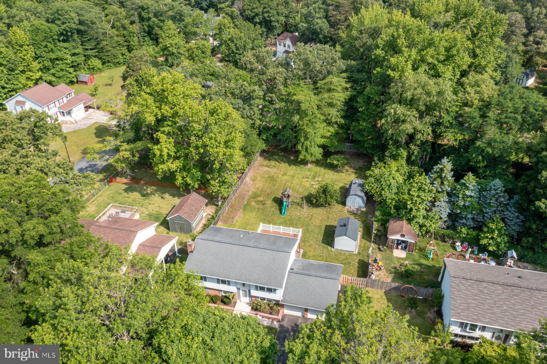8304 Grainfield Road Severn, MD 21144 - Photo 35 of 49 an aerial view of residential house with outdoor space and trees all around