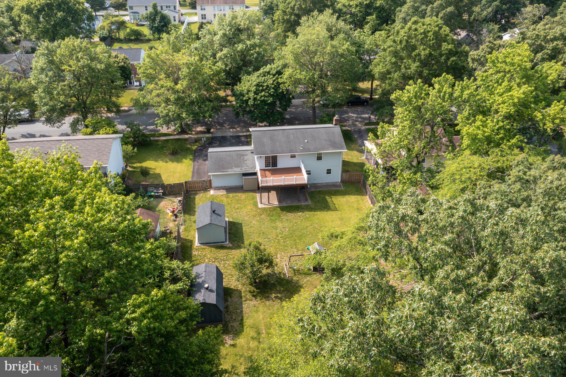 8304 Grainfield Road Severn, MD 21144 - Photo 38 of 49 an aerial view of a house with a yard swimming pool and outdoor seating