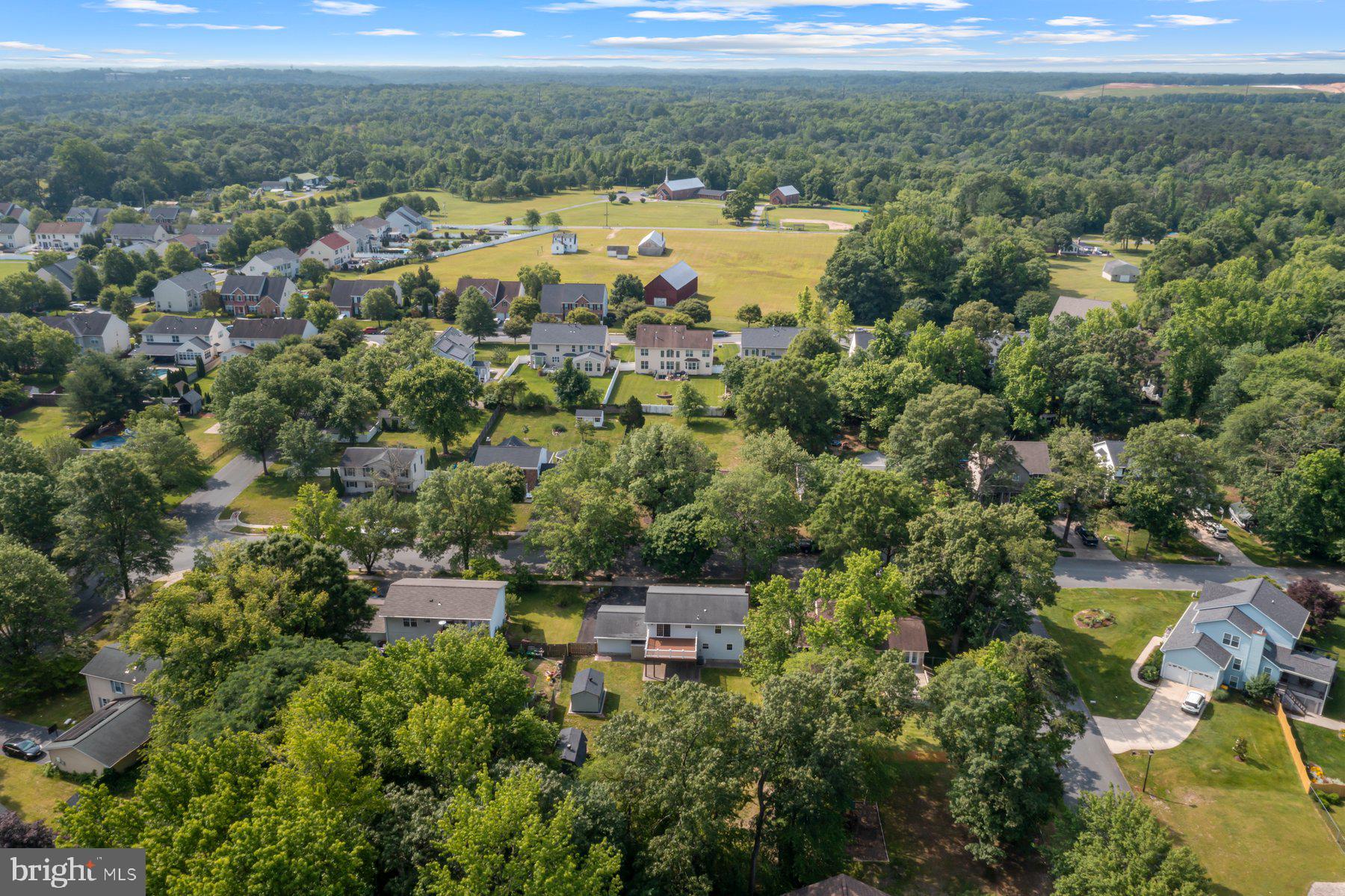 8304 Grainfield Road Severn, MD 21144 - Photo 40 of 49 an aerial view of a house with a yard