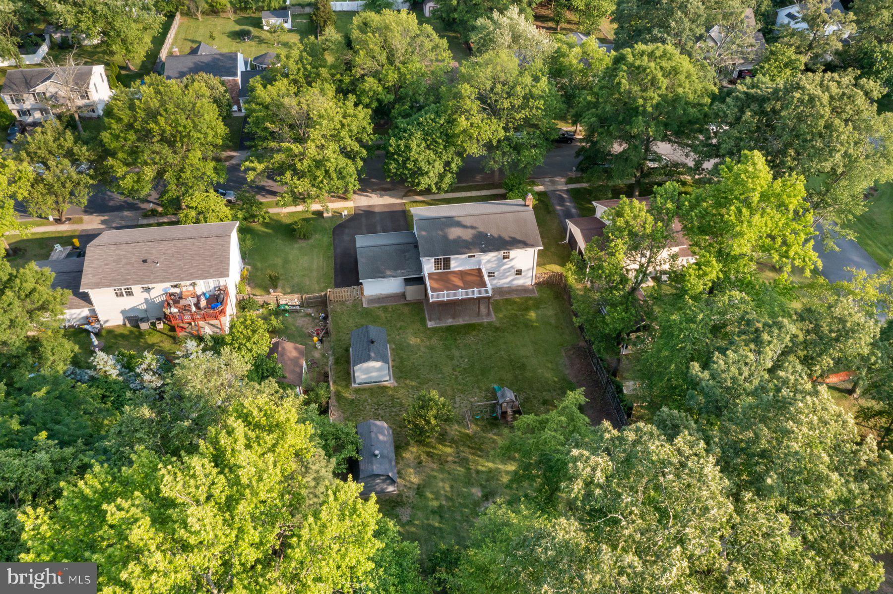 8304 Grainfield Road Severn, MD 21144 - Photo 44 of 49 an aerial view of a house with swimming pool and garden