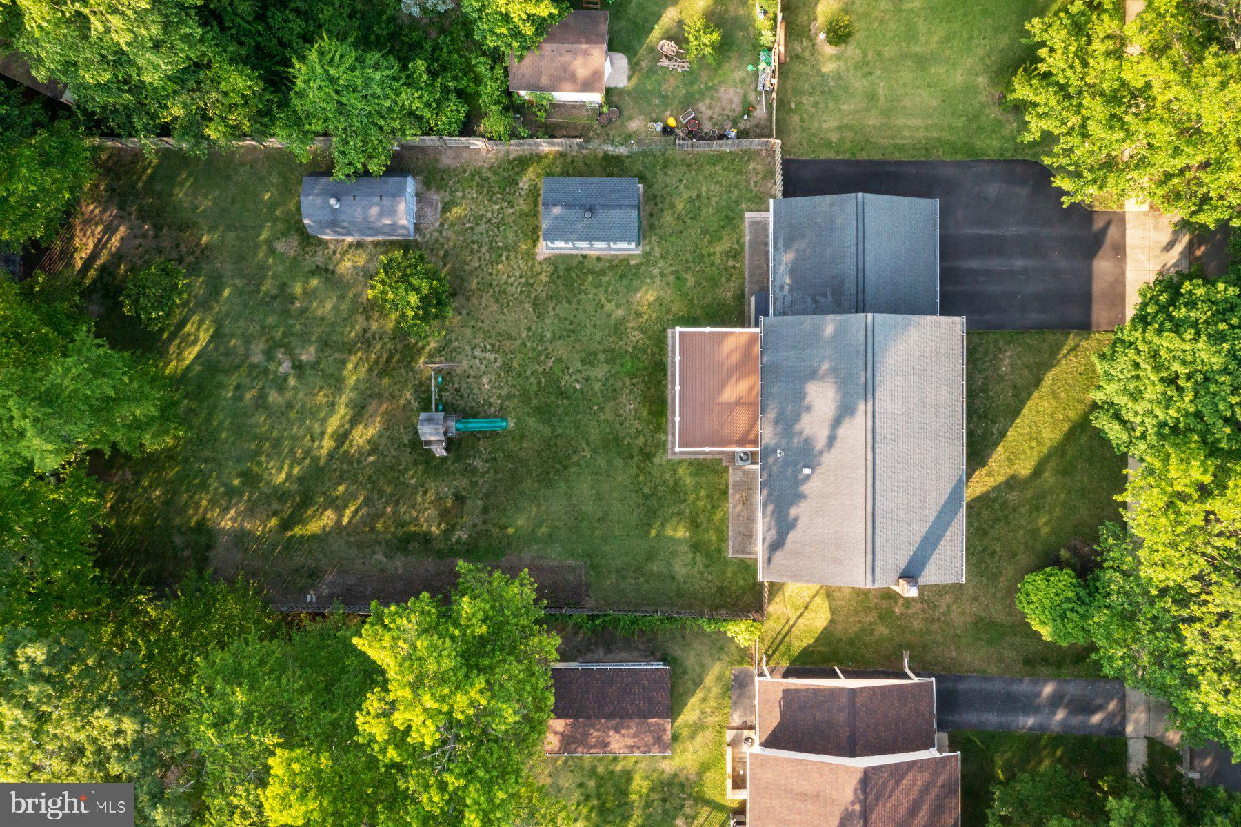 8304 Grainfield Road Severn, MD 21144 - Photo 45 of 49 an aerial view of a house with a yard basket ball court and outdoor seating