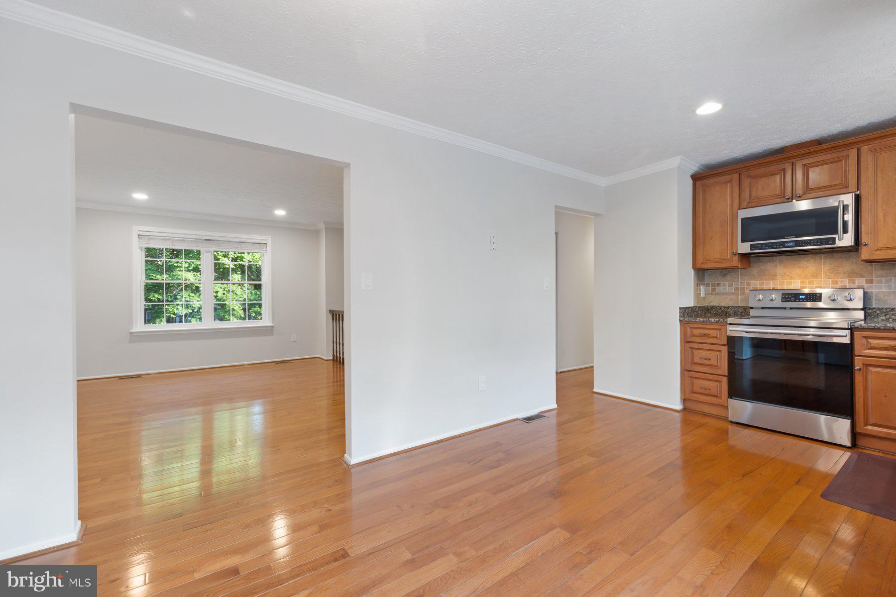 8304 Grainfield Road Severn, MD 21144 - Photo 5 of 49 a view of kitchen with microwave and stove top oven