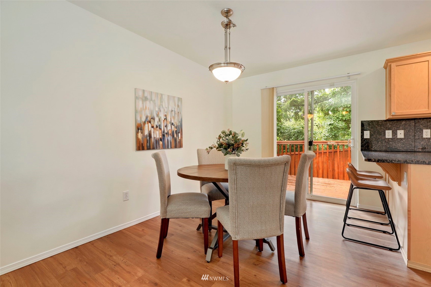 1322 196th Place Southeast Bothell, WA 98012 - Photo 8 of 40 a view of a dining room with furniture window and wooden floor