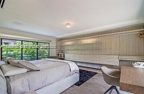 635 Curtiswood Drive Key Biscayne, FL 33149 - Photo 11 of 22 a bed sitting in a bedroom next to a window