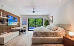 635 Curtiswood Drive Key Biscayne, FL 33149 - Photo 13 of 22 a bedroom with a large bed and a window