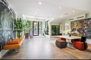 635 Curtiswood Drive Key Biscayne, FL 33149 - Photo 3 of 22 a living room filled with furniture and a large window