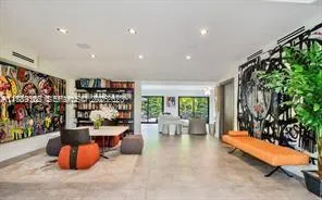 a room with lots of table and chairs