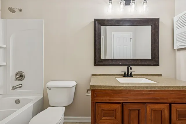 a bathroom with a toilet a sink and a bathtub