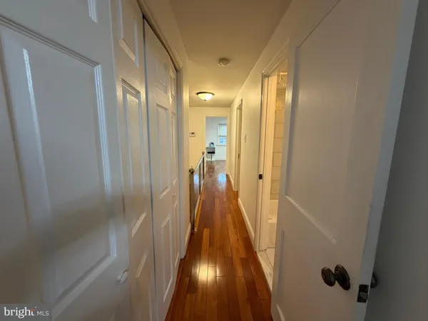 a view of a bathroom from the hallway