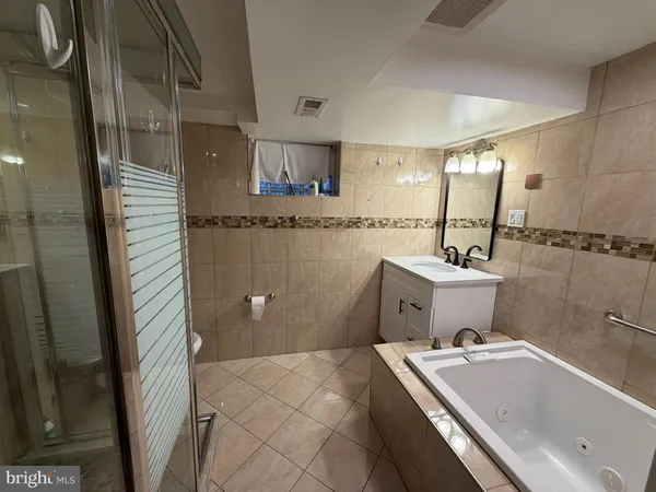 a bathroom with a sink and mirror