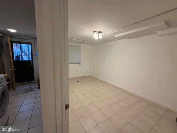 a view of a storage & utility room with racks on the wall