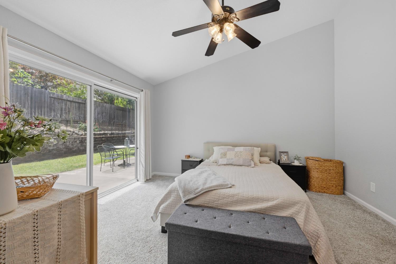 5013 Charter Road Rocklin, CA 95765 - Photo 19 of 35 a bedroom with a bed and large window