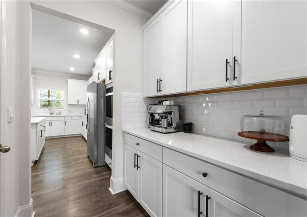146 Citrine Way Acworth, GA 30101 - Photo 11 of 48 a kitchen with sink cabinets and refrigerator
