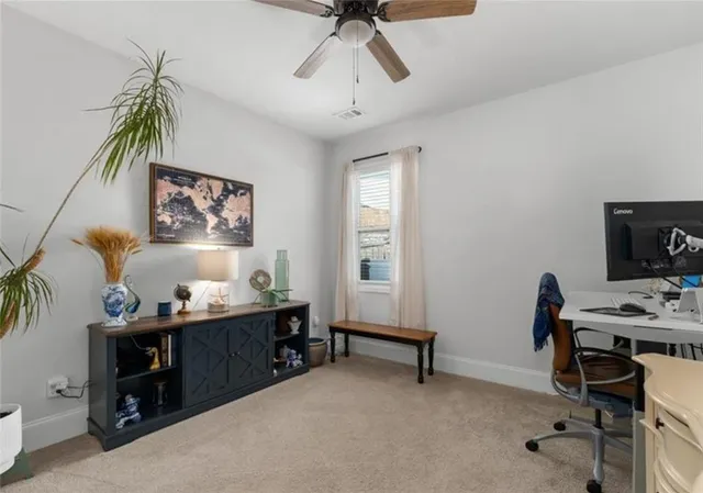 a bedroom with a workspace