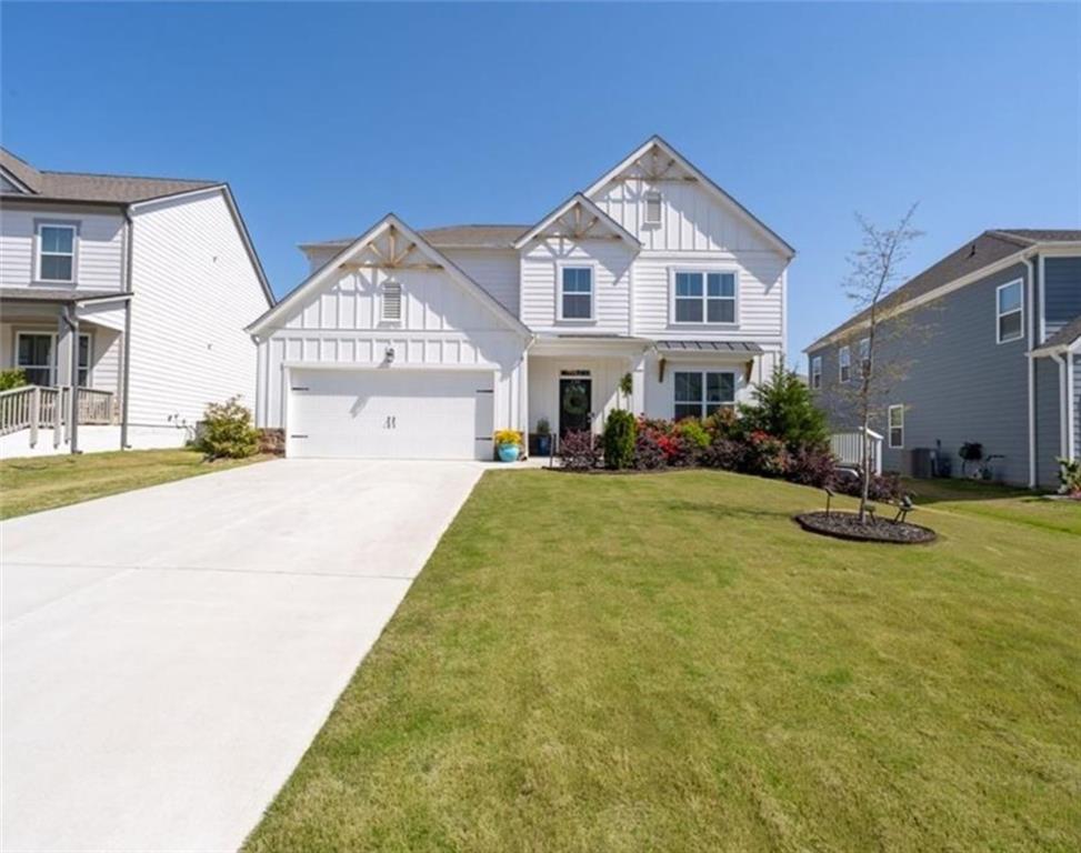 146 Citrine Way Acworth, GA 30101 - Photo 2 of 48 a view of a white house with swimming pool in front of it