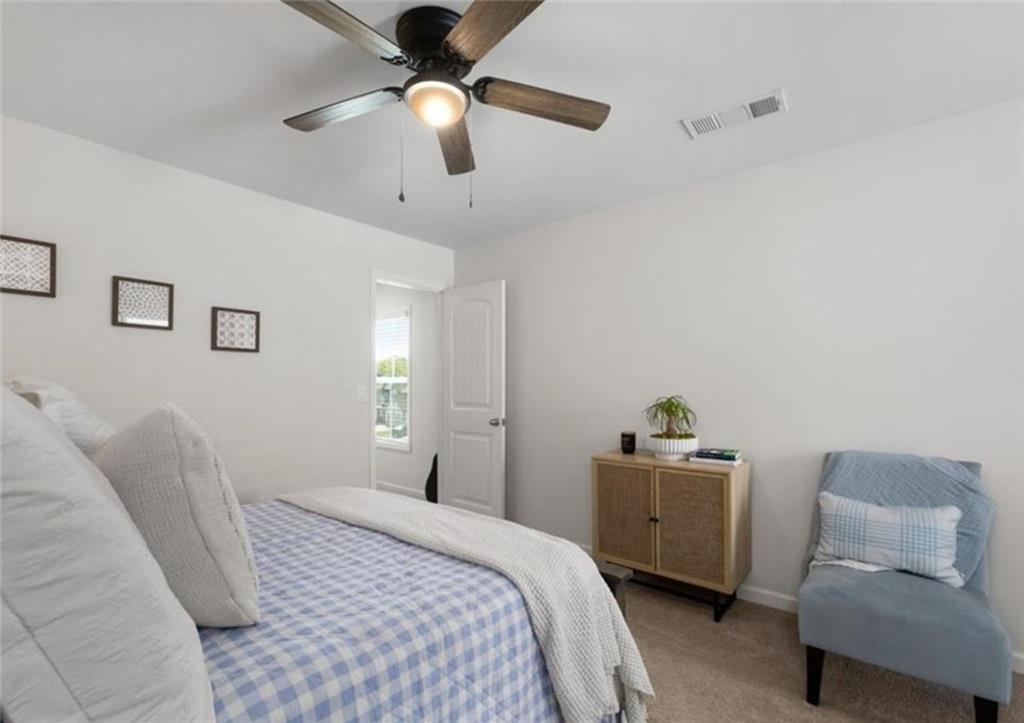 146 Citrine Way Acworth, GA 30101 - Photo 23 of 48 a bedroom with a bed and a chair