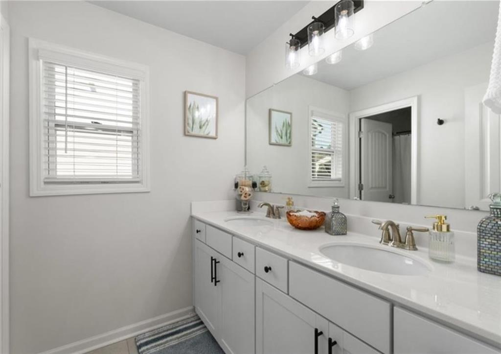 146 Citrine Way Acworth, GA 30101 - Photo 25 of 48 a bathroom with a sink a stove and a mirror