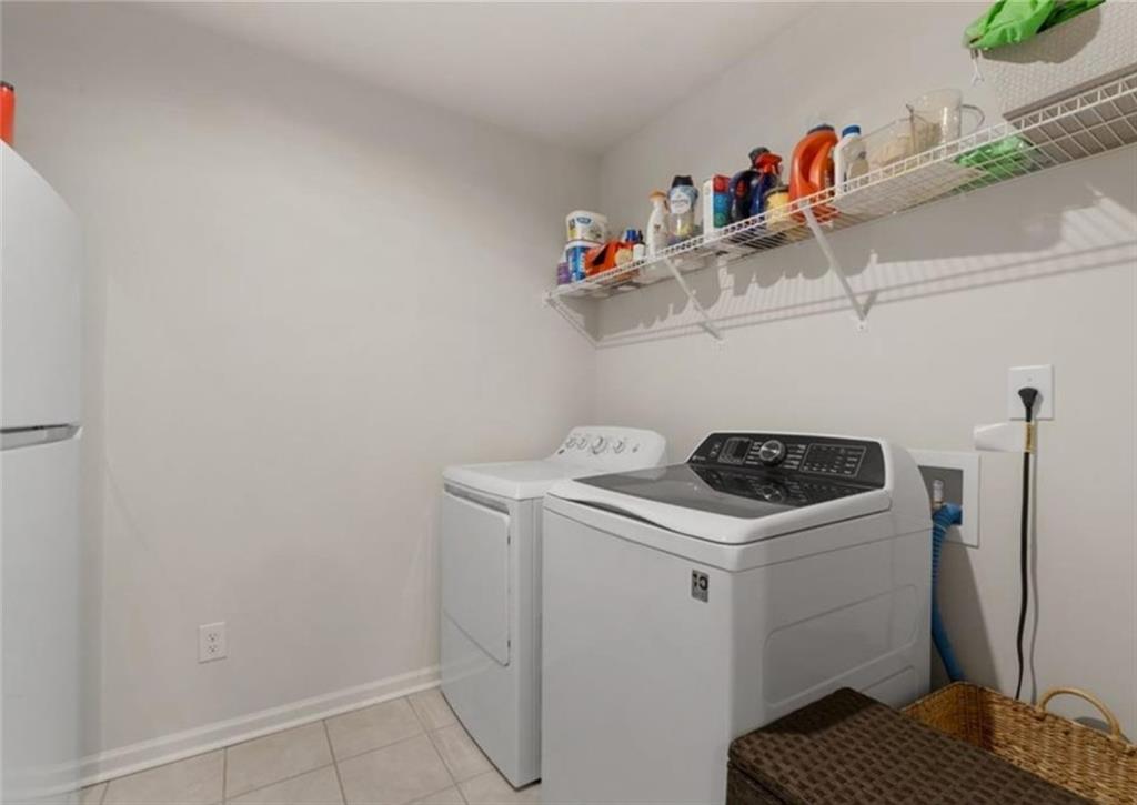 146 Citrine Way Acworth, GA 30101 - Photo 28 of 48 a utility room with dryer and washer