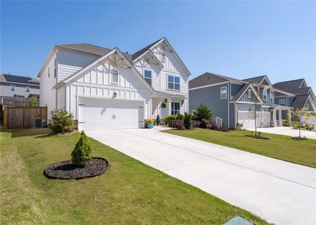 a front view of a house with a yard
