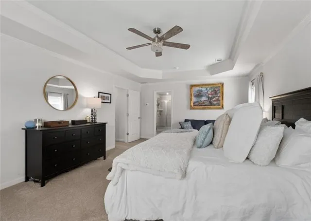 a bed room with a bed and a mirror