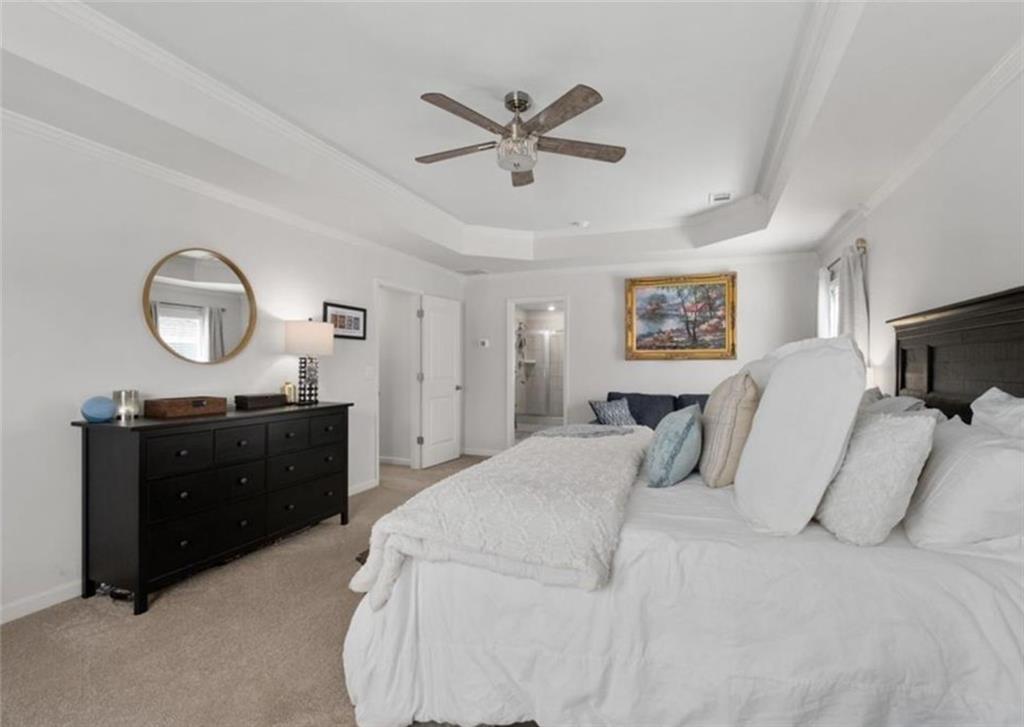 146 Citrine Way Acworth, GA 30101 - Photo 32 of 48 a bed room with a bed and a mirror