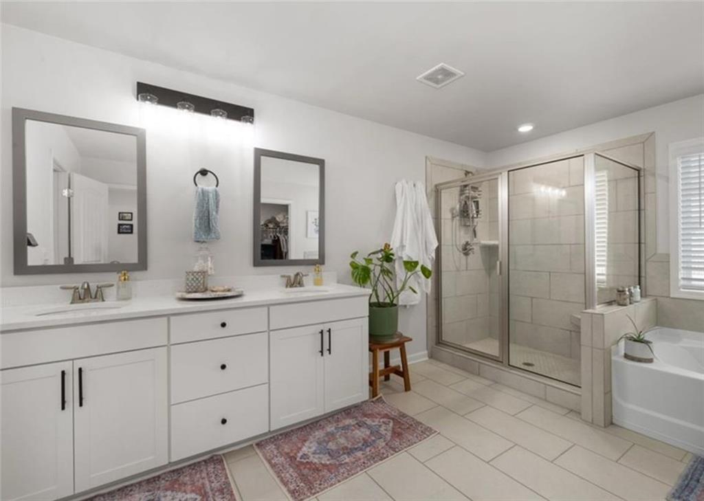 146 Citrine Way Acworth, GA 30101 - Photo 33 of 48 a bathroom with a double vanity sink mirror and bathtub