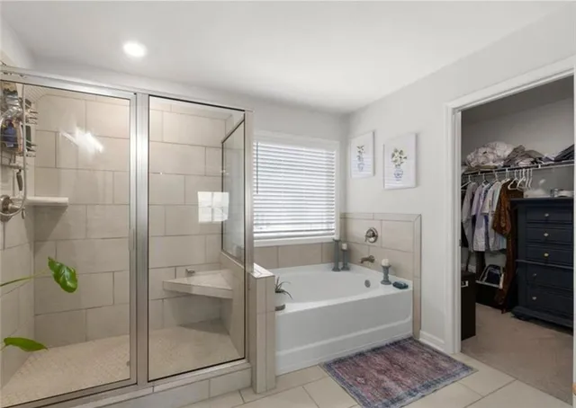 a bathroom with a bathtub and a shower