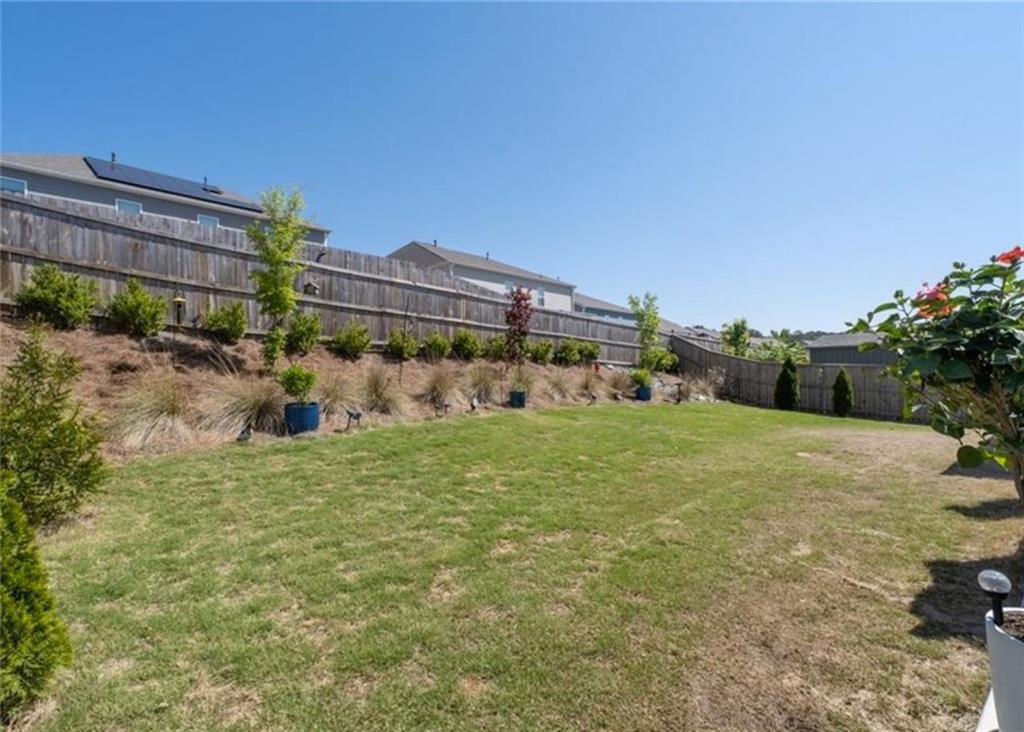 146 Citrine Way Acworth, GA 30101 - Photo 36 of 48 a view of a big yard with a house