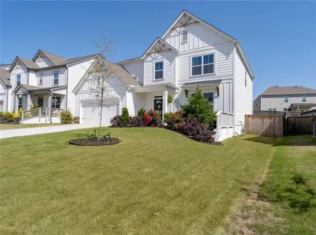 a front view of a house with garden