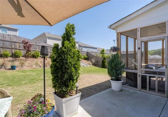 a view of a swimming pool with a patio