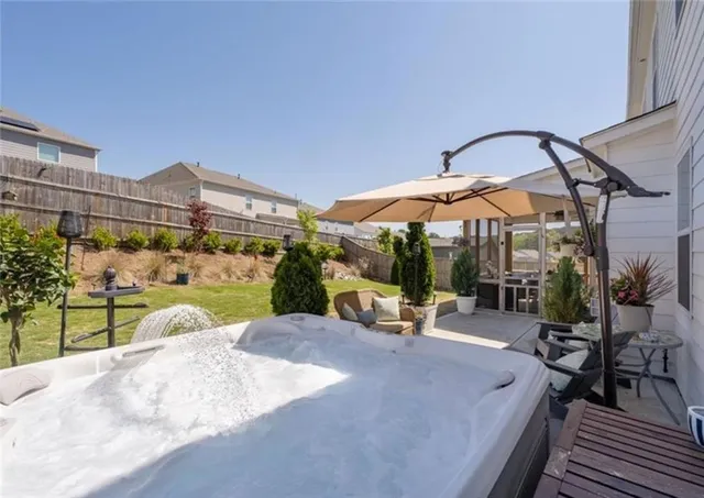 a view of a swimming pool with a lounge chair