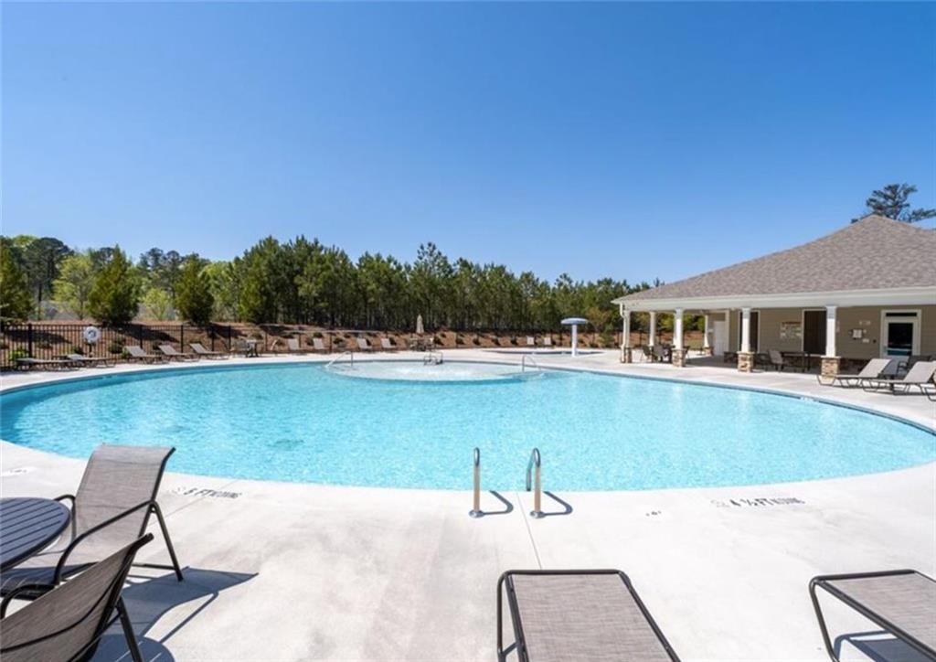 146 Citrine Way Acworth, GA 30101 - Photo 47 of 48 a view of a swimming pool with a lounge chair