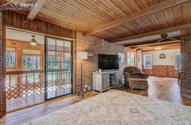 749 Aspen Village Road Divide, CO 80814 - Photo 12 of 49 A sliding glass door opens on to the walkway that overlooks the sunroom