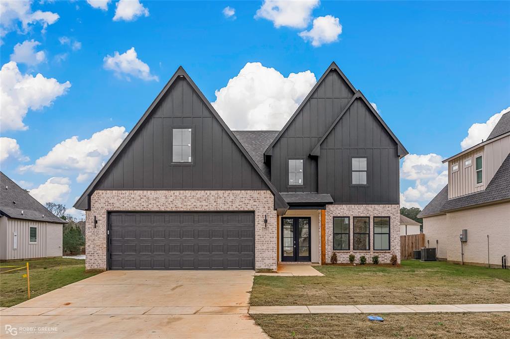 75 Turtle Creek Drive Benton, LA 71006 - Photo 1 of 32 a front view of a house with a yard