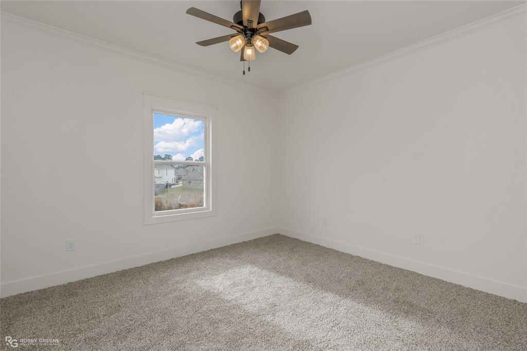 75 Turtle Creek Drive Benton, LA 71006 - Photo 24 of 32 an empty room with a window and a fan