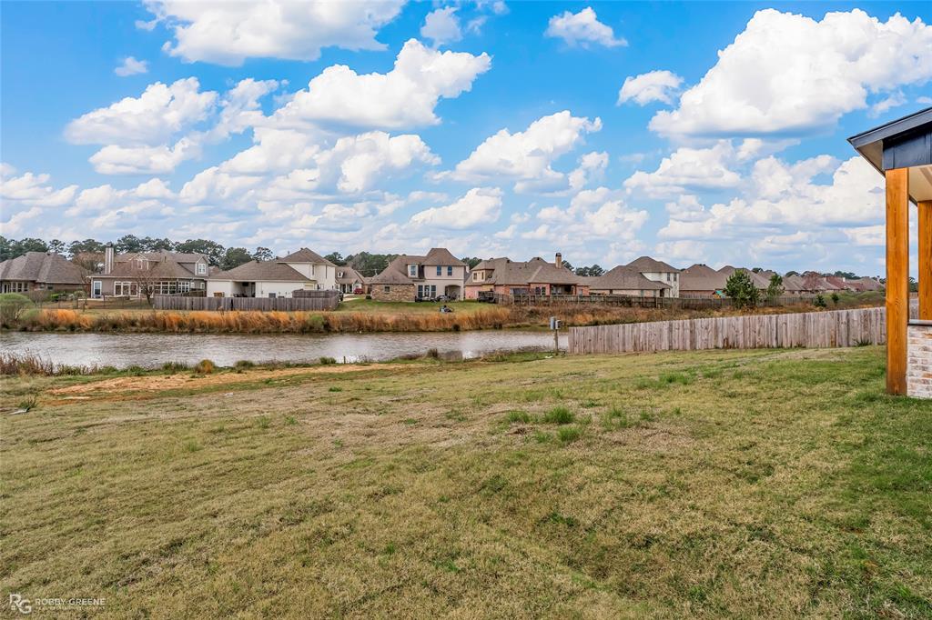 75 Turtle Creek Drive Benton, LA 71006 - Photo 30 of 32 a view of a lake with houses in the back