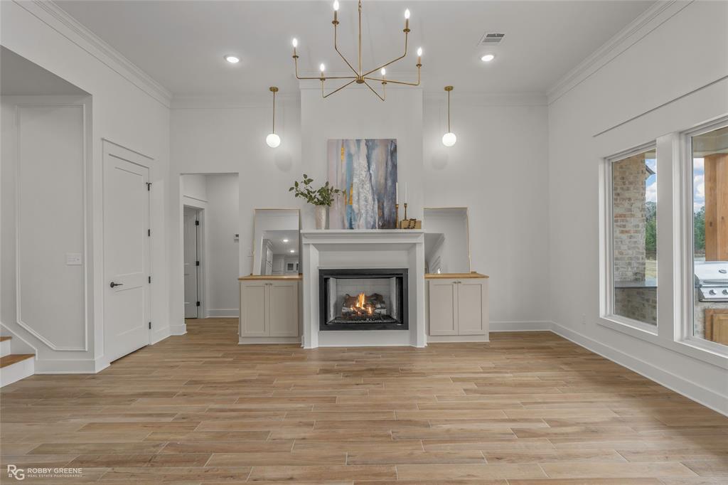 75 Turtle Creek Drive Benton, LA 71006 - Photo 3 of 32 a view of an empty room with a fireplace and window