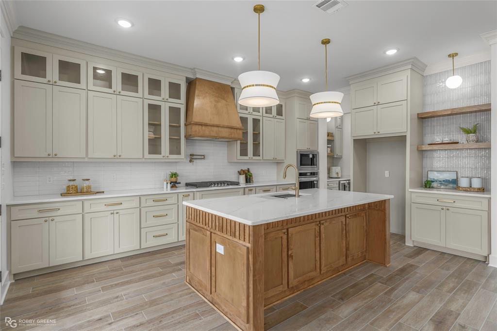 75 Turtle Creek Drive Benton, LA 71006 - Photo 7 of 32 a kitchen with a sink and cabinets