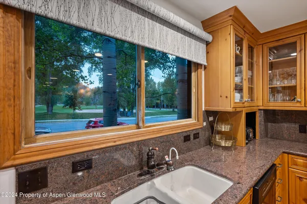a view of a two chairs in the patio