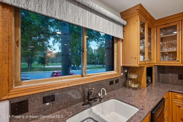 a view of a two chairs in the patio