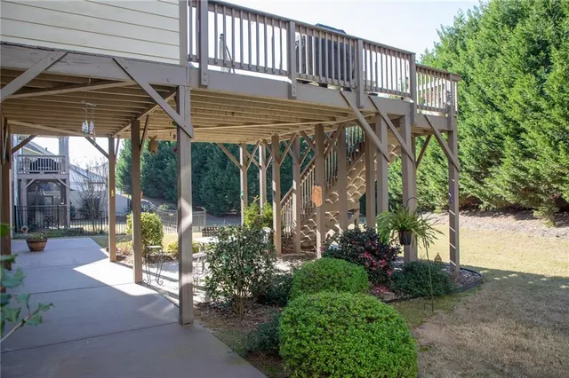 a view of a patio with table and chairs and potted plants