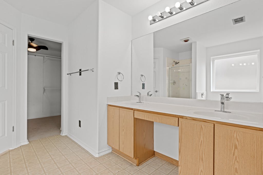 915 Satellite View Round Rock, TX 78665 - Photo 20 of 36 a bathroom with a sink and a mirror