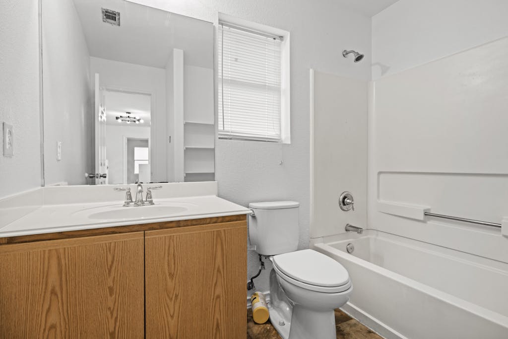 915 Satellite View Round Rock, TX 78665 - Photo 24 of 36 a bathroom with a sink a toilet and shower