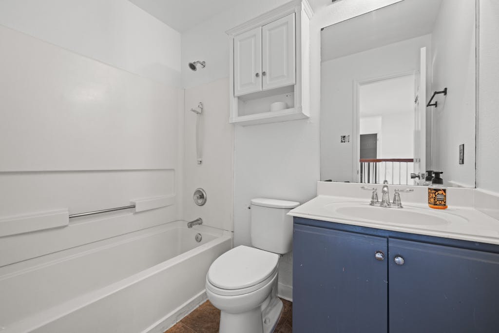 915 Satellite View Round Rock, TX 78665 - Photo 30 of 36 a bathroom with a sink a toilet and shower