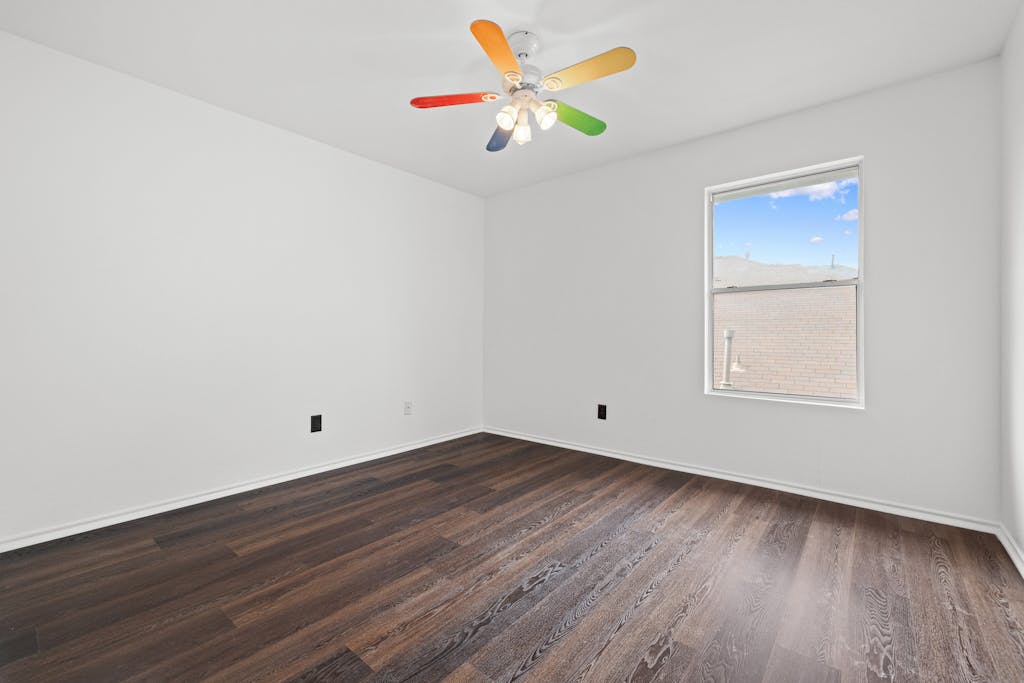 915 Satellite View Round Rock, TX 78665 - Photo 31 of 36 a view of an empty room with window and wooden floor