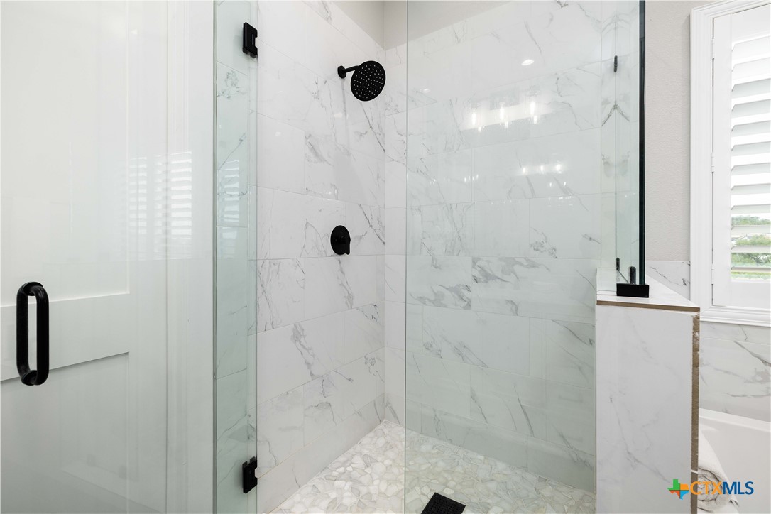 537 Compass Rose Spring Branch, TX 78070 - Photo 18 of 29 a bathroom with a shower